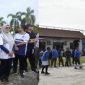 Ket. Foto : Sekda Kota Langsa Dra. Suhartini, S.Pd, M.Pd, Yang , Juga Selaku Ketua KORPRI, Membuka Turnamen Volley. 