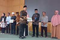 Ket. Foto : Penyaluran Zakat Infak dan Sedekah tahun 2024 dan penyaluran Zakat Asnaf Fakir dan Miskin tahun 2025, di Aula Gedung Cakra Donya Langsa Kota, Kamis (25 September 2025).